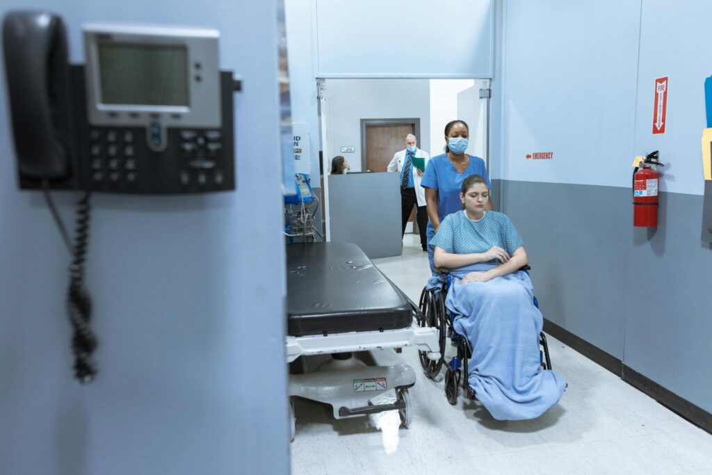 Healthcare professionals assisting a patient in a hospital